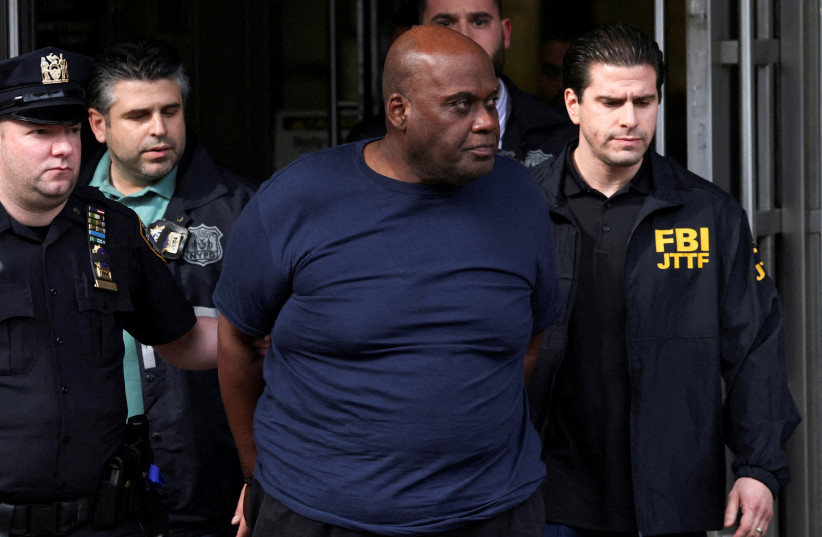  Frank James, the suspect in the Brooklyn subway shooting walks outside a police precinct in New York City, New York, U.S., April 13, 2022. (credit: REUTERS/ANDREW KELLY)