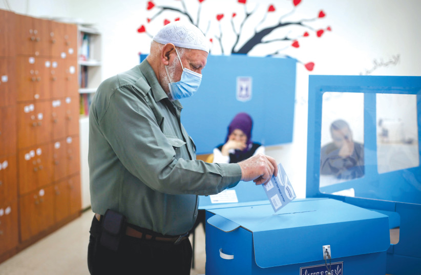  AN ARAB-ISRAELI voter casts his ballot at a polling station in Kafr Manda, in the March 2021 Knesset election. Between the river and the sea there is a non-Jewish majority and they do not live with democracy, says the writer. (credit: JAMAL AWAD/FLASH90)