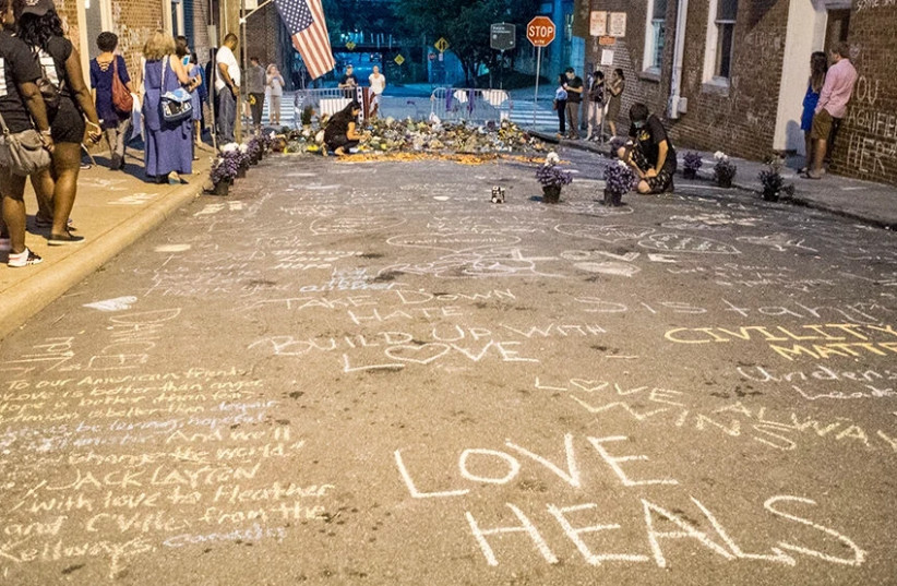 A memorial for Heather Heyer, who was killed. On August 12, 2017, a car was deliberately driven into a crowd of people who had been peacefully protesting the Unite the Right rally in Charlottesville, Virginia, killing one and injuring 28. (photo credit: GETTY IMAGES)