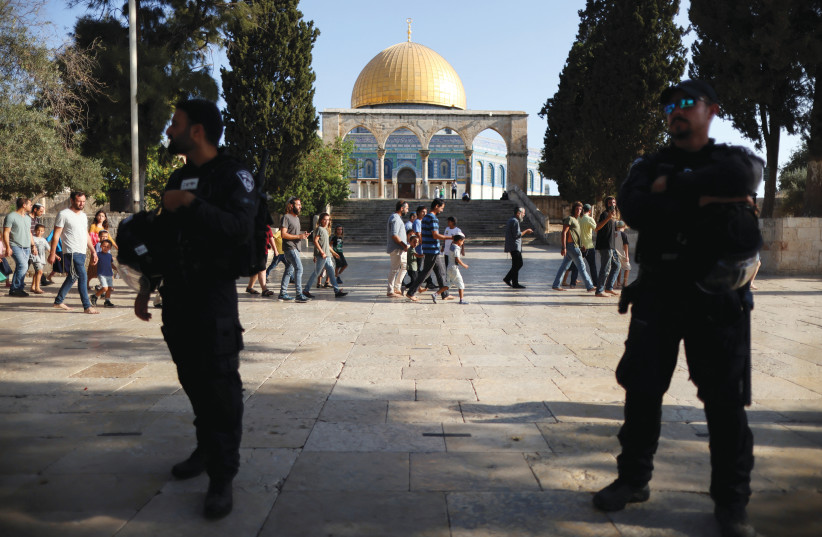  ISRAELI POLICE stand by as Jews visit the Temple Mount in Jerusalem’s Old City last year. (photo credit: AMMAR AWAD/REUTERS)