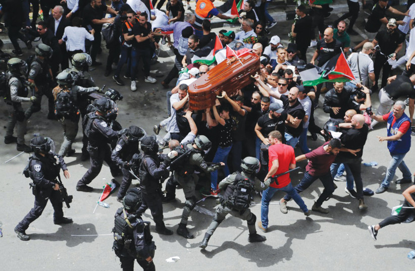  A FACE-OFF between police and mourners at the funeral procession of Al Jazeera journalist Shireen Abu Akleh, killed during an IDF operation in Jenin. (credit: MAYA LEVIN)