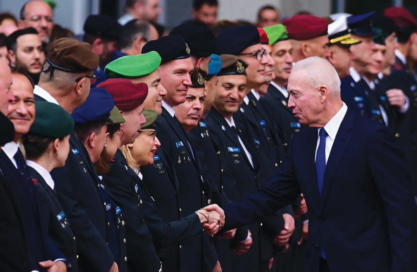  DEFENSE MINISTER Yoav Gallant participates in the changing of the guard ceremony at the Defense Ministry in Tel Aviv on Sunday as he assumes his new position. (photo credit: TOMER NEUBERG/FLASH90)