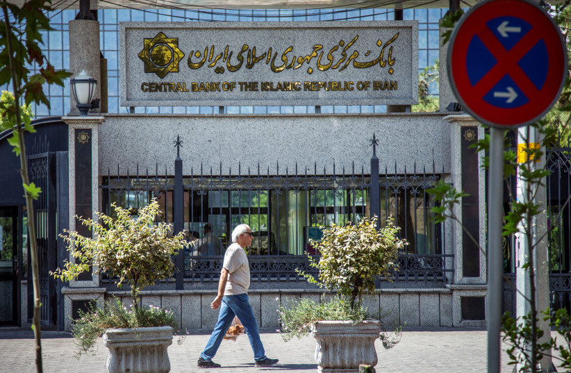 A man walks past the Central bank of Iran in Tehran, Iran August 1, 2019 (photo credit: NAZANIN TABATABAEE/WANA (WEST ASIA NEWS AGENCY) VIA REUTERS)