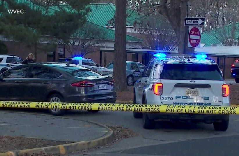 Police vehicles are seen parked outside Richneck Elementary School, where according to the police, a six-year-old boy shot and wounded a teacher, in Newport News, Virginia, US, January 6, 2023, in this screen grab from a handout video. (photo credit: WVEC VIA ABC/HANDOUT VIA REUTERS)
