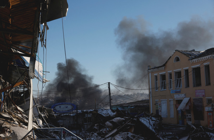 Plumes of smoke rise from a Russian strike during a 36-hour ceasefire over Orthodox Christmas declared by Russian President Vladimir Putin, as Russia's attack on Ukraine continues, from the frontline Donbas city of Bakhmut, Ukraine, January 7, 2023. (photo credit: REUTERS/CLODAGH KILCOYNE/FILE PHOTO)