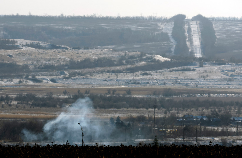Plumes of smoke rise from a Russian strike during a 36-hour ceasefire over Orthodox Christmas declared by Russian President Vladimir Putin, as Russia's attack on Ukraine continues, from the frontline Donbas city of Bakhmut, Ukraine, January 7, 2023. (credit: REUTERS/CLODAGH KILCOYNE/FILE PHOTO)