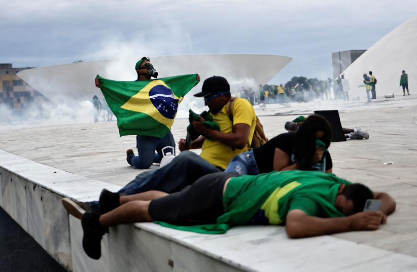 Supporters of Brazil's former President Jair Bolsonaro demonstrate against President Luiz Inacio Lula da Silva, in Brasilia (credit: REUTERS)