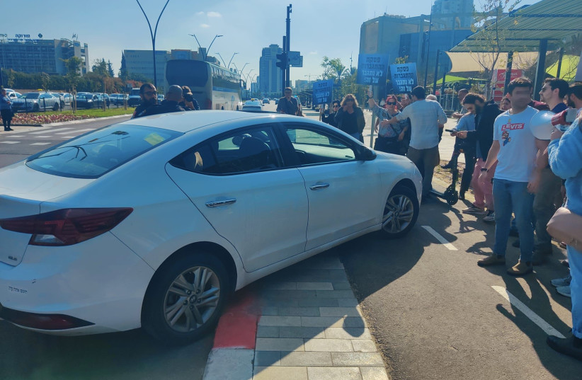 A driver attempted to ram into left-wing protesters in Beersheba, January 10, 2023 (photo credit: Tomer Wiener)