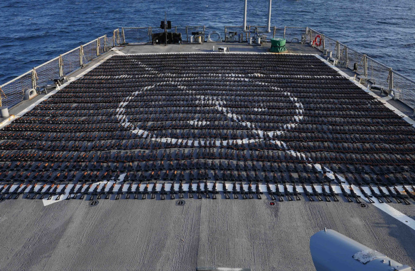  Thousands of AK-47 assault rifles sit on the flight deck of guided-missile destroyer USS The Sullivans (DDG 68) during an inventory process, Jan. 7. (credit: US NAVY)