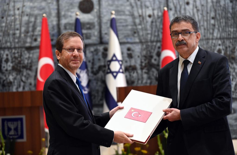  Turkish Ambassador to Israel Sakir Ozkan Torunlar presents his credential to President Isaac Herzog. (photo credit: HAIM ZACH/GPO)