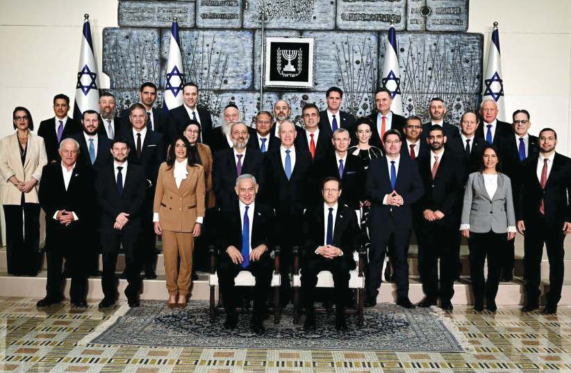  President Isaac Herzog and Prime Minister Benjamin Netanyahu sat at the center of the traditional photograph of the new government, on December 29, 2022,  at the President’s Residence, for the swearing-in of Israel’s 37th government. (photo credit: Avi Ohayon/GPO)