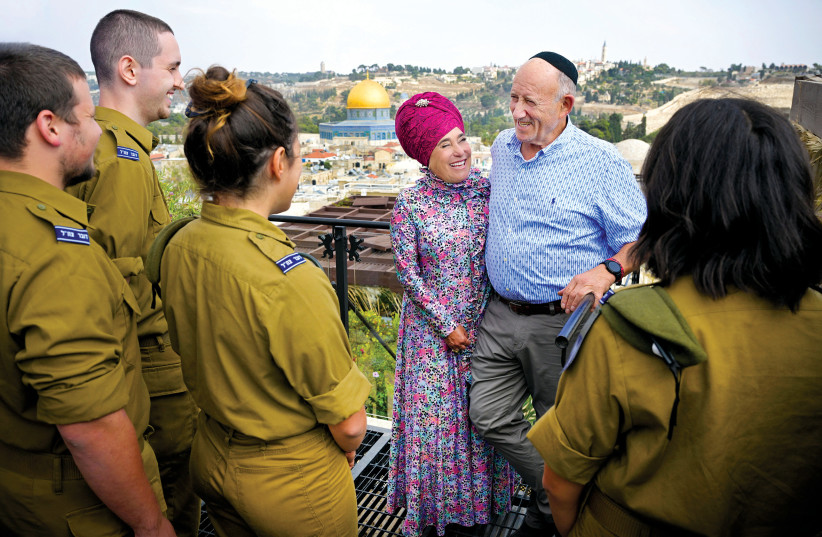  SEIZING THE MOMENTUM: Aba and Pamela Claman with IDF soldiers, overlooking the Kotel. (photo credit: YOSSI ZWECKER)