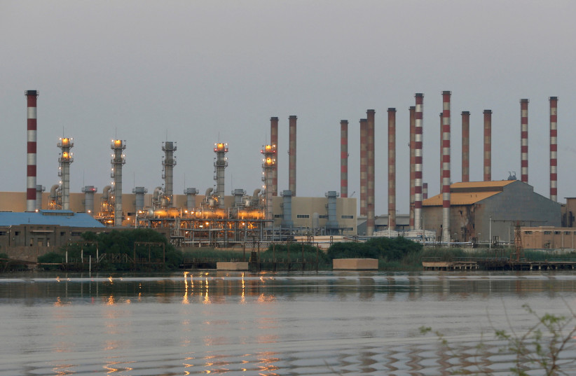  A general view of Abadan oil refinery in southwest Iran, is pictured from Iraqi side of Shatt al-Arab in Al-Faw south of Basra, Iraq September 21, 2019.  (photo credit: ESSAM AL-SUDANI/ REUTERS)