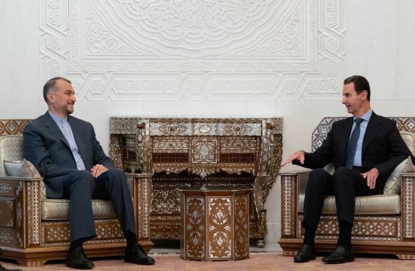 Syria's President Bashar al-Assad meets with Iranian Foreign Minister Hossein Amirabdollahian in Damascus, Syria, January 14, 2023. (photo credit: SYRIAN PRESIDENCY/HANDOUT VIA REUTERS)