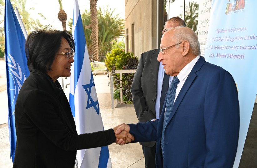  UN Undersecretary-General for Disaster Risk Reduction (UNDRR) Mami Mizutori is seen alongside Holon Mayor Motti Sasson recognizing Holon as Israel's first center of resilience against climate change crises. (credit: HOLON MUNICIPALITY)