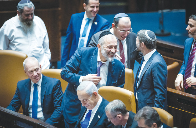  PRIME MINISTER Benjamin Netanyahu and members of his new government celebrate following their swearing-in at the Knesset last month. (photo credit: YONATAN SINDEL/FLASH90)