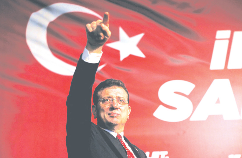  ISTANBUL MAYOR Ekrem Imamoglu greets his supporters during a rally to oppose the conviction and political ban imposed on him, in Istanbul, last month. (credit: DILARA SENKAYA/REUTERS)