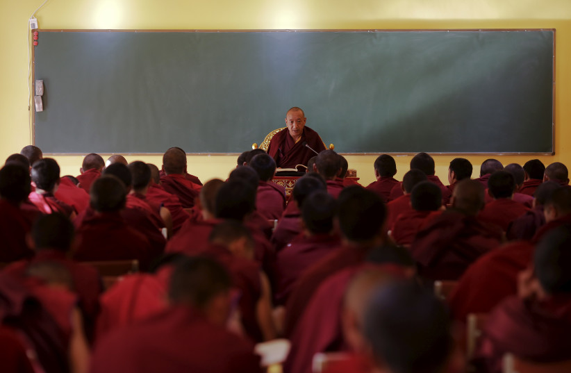  Tibetan Buddhist monks attend a lecture at Sera monastery in Lhasa, Tibet Autonomous Region, China November 19, 2015 (photo credit: REUTERS/DAMIR SAGOLJ/FILE PHOTO)