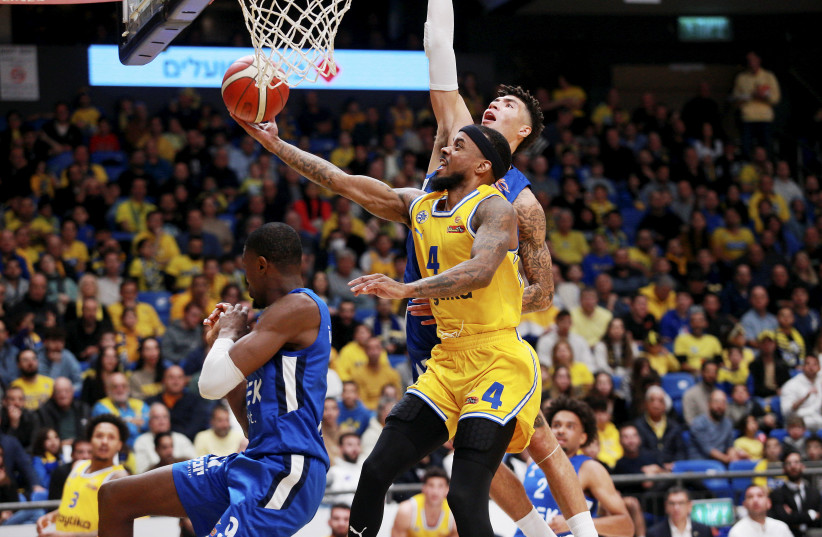  MACCABI TEL AVIV guard Lorenzo Brown goes to the basket for two of his 17 points in the yellow-and-blue’s 105-89 State Cup quarterfinal win over Bnei Herzliya. (photo credit: Kobi Eliyahu)