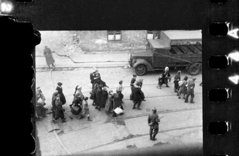  being led to Umschlagplatz; photo taken from a window of St Zofia Hospital in Warsaw. (photo credit: Z. L. Grzywaczewski/Family archive of Maciej Grzywaczewski/print from the negative: POLIN Museum)