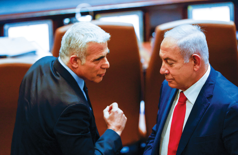  BENJAMIN NETANYAHU and Yair Lapid encounter each other in the Knesset plenum. For both sides, short-term victory could mean long-term damage to our society, says the writer. (photo credit: OLIVIER FITOUSSI/FLASH90)