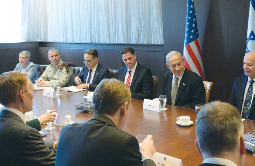  FLANKED BY Ron Dermer on his right and Tzachi Hanegbi on his left, Prime Minister Benjamin Netanyahu meets with a bipartisan US Senate delegation that is part of the Abraham Accords lobby, on Wednesday.  (credit: AMOS BEN-GERSHOM/GPO)
