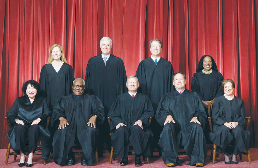  US SUPREME Court justices pose for a formal group photograph, in October. The Israeli Supreme Court has arrogated to itself all of the powers of the US Supreme Court with none of the corresponding limitations, restrictions or burdens, says the writer. (photo credit: US Supreme Court/Reuters)