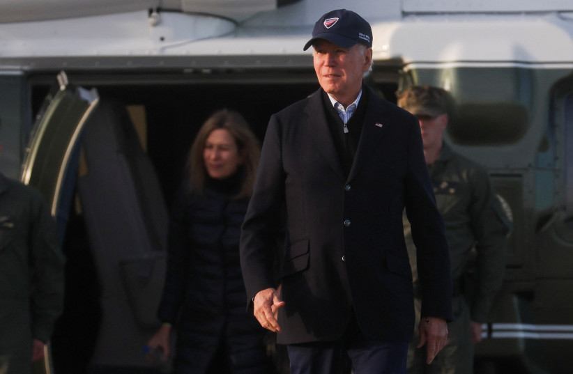 US President Joe Biden walks after getting off Marine One to board Air Force One, after surveying storm-damaged areas of California's central coast, in Moffett Federal Airfield, Santa Clara County, California, US, January 19, 2023.  (credit: LEAH MILLIS/REUTERS)