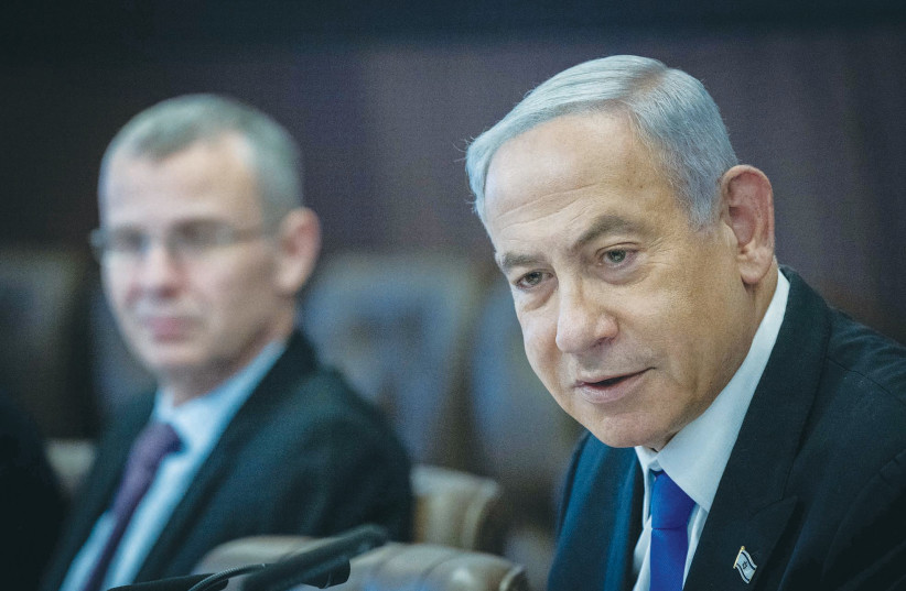  PRIME MINISTER Benjamin Netanyahu holds last Sunday’s cabinet meeting at the Prime Minister’s Office in Jerusalem, as Justice Minister Yariv Levin looks on.  (photo credit: YONATAN SINDEL/FLASH90)