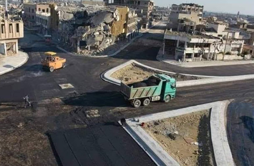  Workers walk alongside a road project in Mosul (photo credit: Municipality of Mosul)