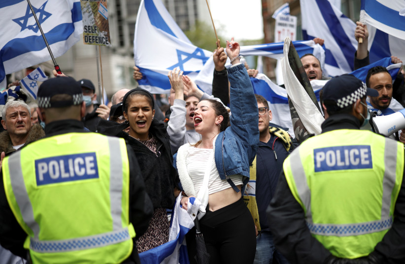  Pro-Israeli demonstrators attend a protest following a flare-up of Israeli-Palestinian violence, in London, Britain, May 23, 2021.  (photo credit: REUTERS/HENRY NICHOLLS)