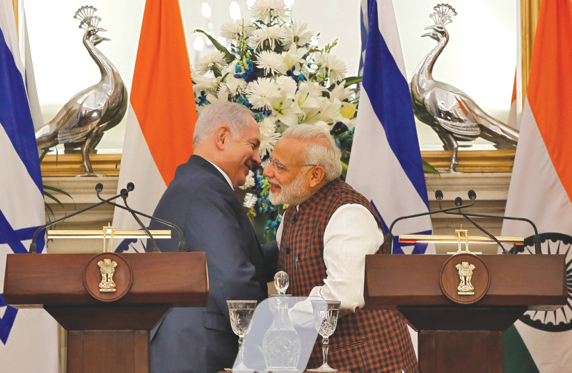  PRIME MINISTER Benjamin Netanyahu and his Indian counterpart, Narendra Modi, hug after attending a ceremony at which agreements were signed between the two countries in several sectors, in New Delhi, in 2018.  (photo credit: Adnan Abidi/Reuters)