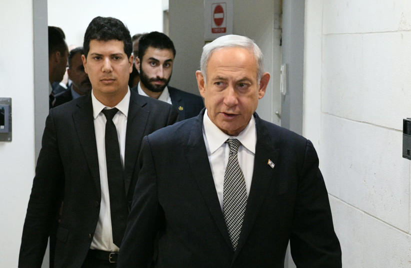  PM Benjamin Netanyahu entering the courtroom before testifying in a defamation lawsuit, January 23, 2023. (credit: REUVEN KASTRO)
