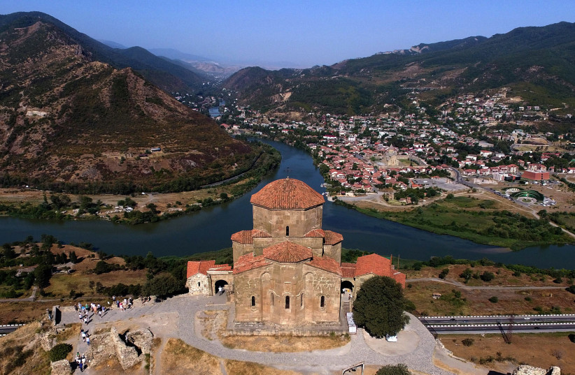 A picture taken with a drone on August 22, 2017 shows a view of the 6th century Jvari monastery and the confluence of the Aragvi and the Kura rivers close to the town of Mtskheta, about 15 km from Tbilisi (photo credit: VANO SHLAMOV/AFP via Getty Images)