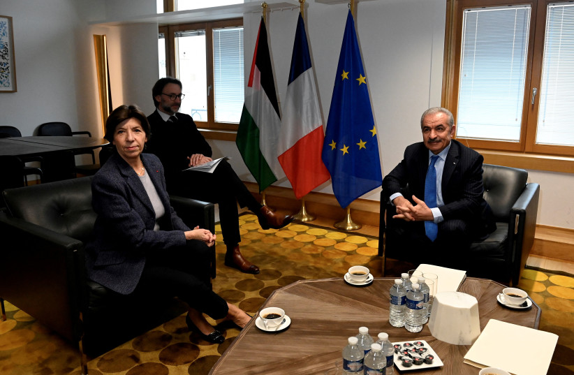  French Foreign and European Affairs Minister Catherine Colonna welcomes Palestinian Prime Minister Mohammad Shtayyeh before a meeting on the sidelines of a EU's Foreign Affairs Council meeting in Brussels, Belgium January 23, 2023. (photo credit: JOHN THYS/POOL VIA REUTERS)