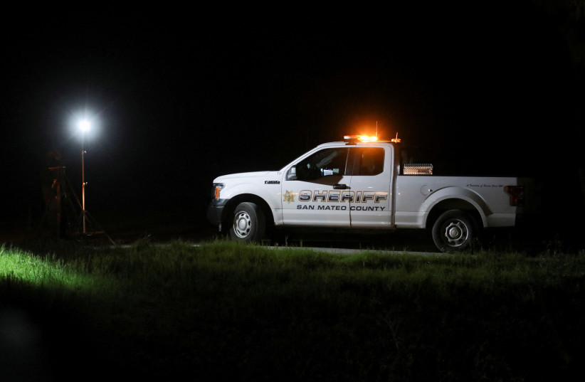  A San Mateo County Sheriff’s Office vehicle is seen near where victims were found dead in a shooting in Half Moon Bay, California, U.S. on January 23, 2023. (credit: REUTERS/NATHAN FRANDINO)