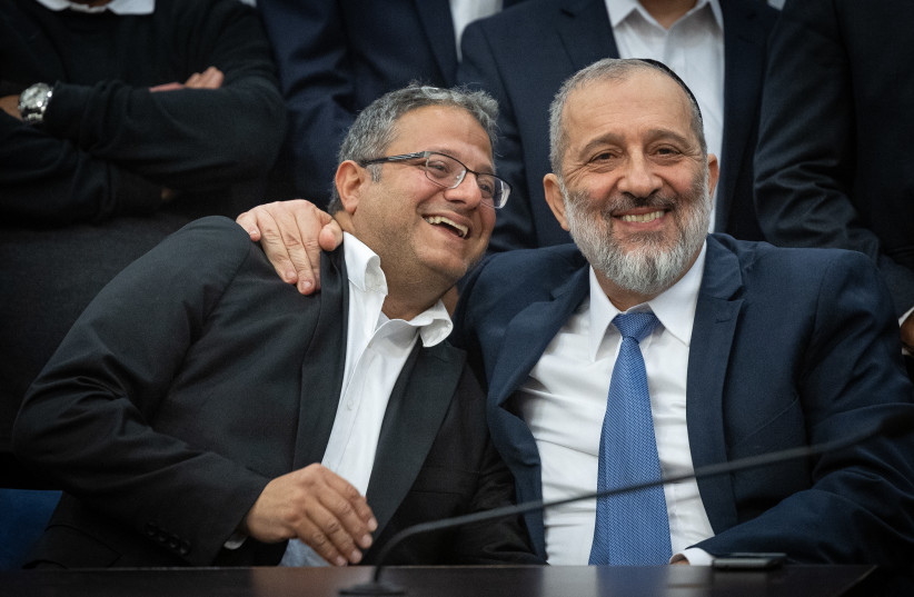 Shas leader MK Aryeh Deri with Israeli National Security Minister Itamar Ben-Gvir during a Shas party meeting, at the Knesset, the Israeli parliament in Jerusalem, on January 23, 2023. (credit: YONATAN SINDEL/FLASH90)