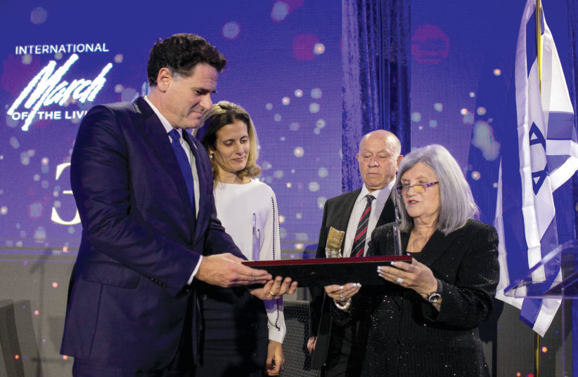  Ron Dermer and his wife, Rhoda, receive a special award from Dr. Shmuel Rosenman and Phyllis Greenberg Heideman, chairman and president of the International March of the Living, at its 35th Anniversary Gala held in Miami, Florida on January 10. (photo credit: COURTESY MOTL)
