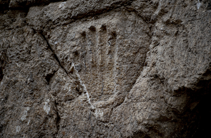  The carved hand on the moat wall (photo credit: IAA)