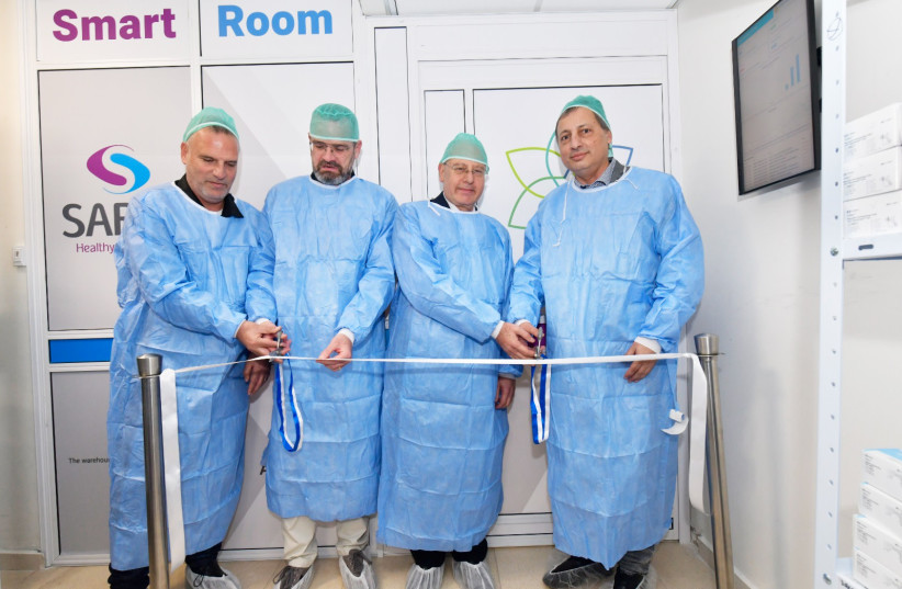  From left to right:  Dror Peer, deputy administrative director and procurement manager, Galilee Medical Center;  Yoav Kastel, CEO, Autonomi; Prof. Masad Barhoum, director-general of Galilee Medical Center; Avi Buskila, CEO, Sarel. (credit: RONI ALBERT)
