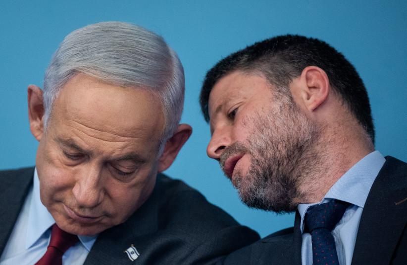  Israeli Prime Minister Benjamin Netanyahu and Finance Minister Bezalel Smotrich seen during a press conference, at the Prime Minister's office in Jerusalem, on January 25, 2023. (credit: YONATAN SINDEL/FLASH90)
