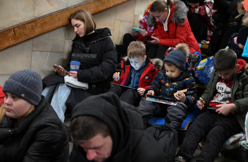  People take shelter inside a metro station during massive Russian missile attacks in Kyiv, Ukraine January 26, 2023.  (photo credit: REUTERS/Viacheslav Ratynskyi)