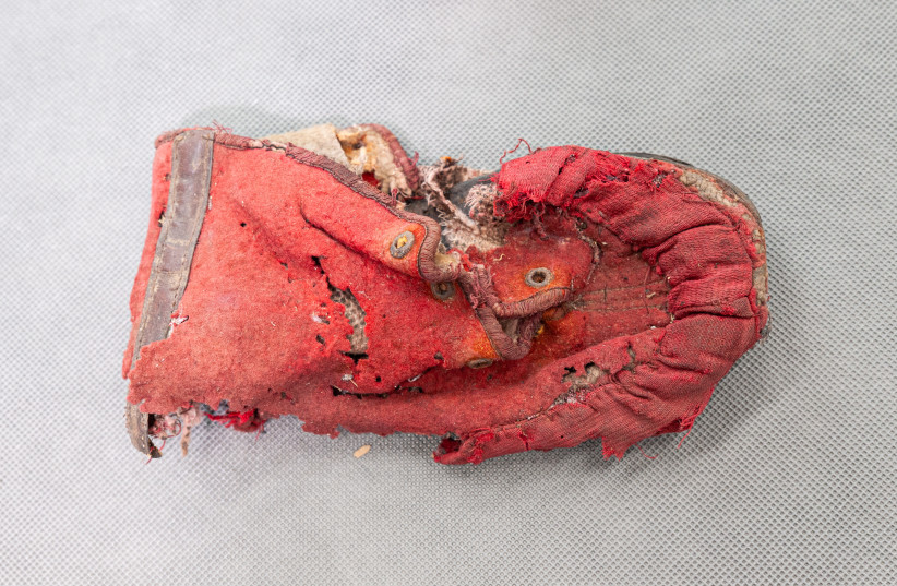  A child's shoe in desperate need of conservation via the Soul to Sole campaign (credit: Pawel Dziedzic)