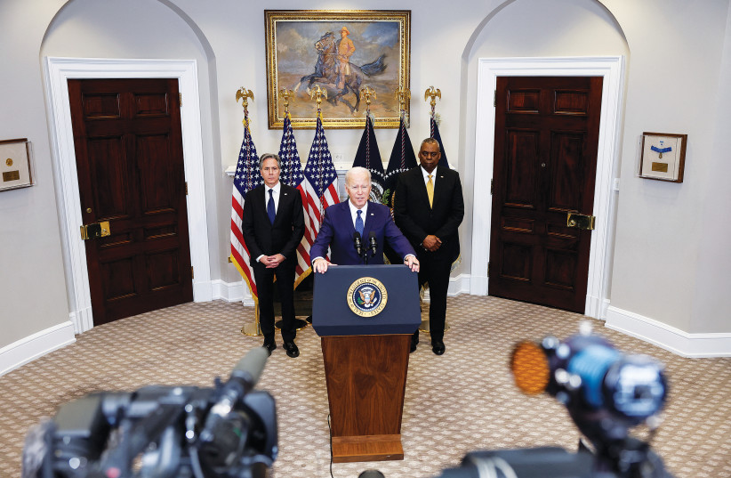  US PRESIDENT Joe Biden is flanked by Secretary of State Antony Blinken and Defense Secretary Lloyd Austin, as he delivers remarks on continued support for Ukraine, at the White House on Wednesday. (photo credit: EVELYN HOCKSTEIN/REUTERS)