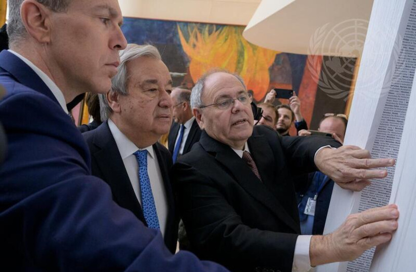  Secretary General Antonio Guterres and Yad Vashem Chairman Dani Dayan inaugurate the Book of Names at UN headquarters in NYC. (photo credit: UN)