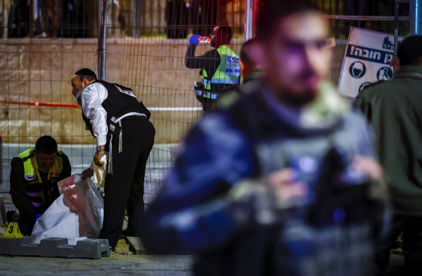  Israeli security forces and rescue forces at the scene of a shooting attack in Neve Yaakov, Jerusalem, January 27, 2023 (photo credit: OLIVIER FITOUSSI/FLASH90)