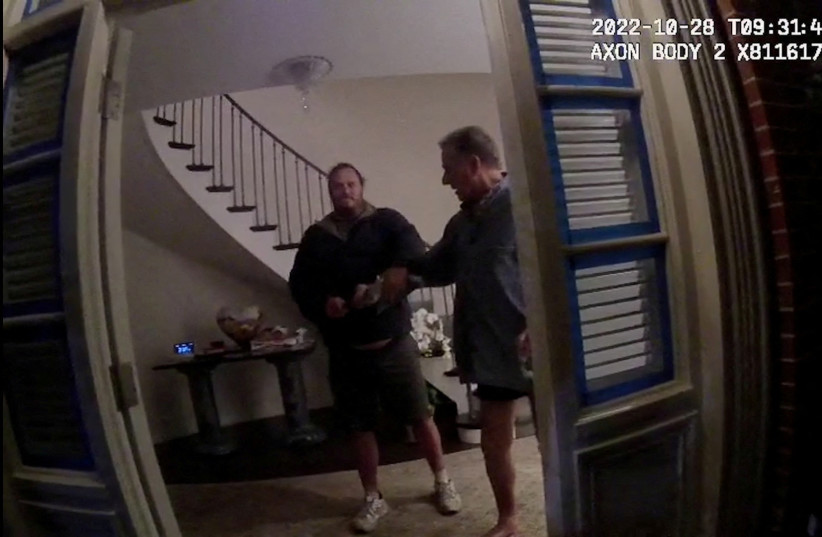  A screenshot from a police body camera video shows David DePape holding onto Paul Pelosi, the husband of then-House Speaker Nancy Pelosi, in the couple’s house on October 28, 2022, in San Francisco (photo credit: District Attorney/Handout via REUTERS)