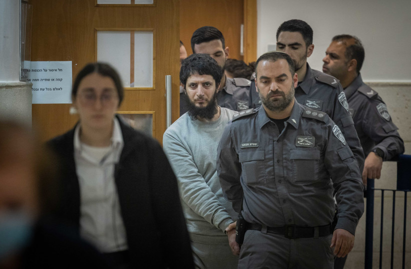  Arafat Irfaiya, charged with the murder of Ori Ansbacher is brought for a court hearing sentence at the Jerusalem District court, on January 29, 2023 (photo credit: YONATAN SINDEL/FLASH90)