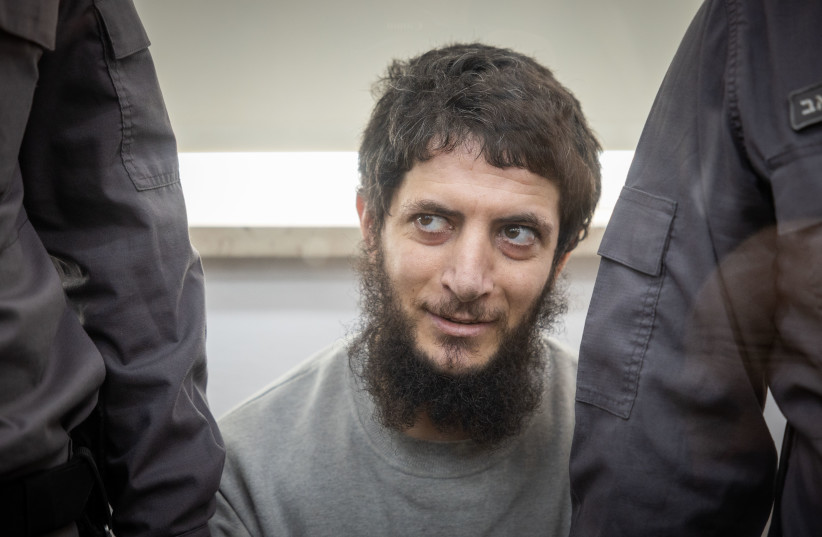  Arafat Irfaiya, charged with the murder of Ori Ansbacher is brought for a court hearing sentence at the Jerusalem District court, on January 29, 2023 (credit: YONATAN SINDEL/FLASH90)
