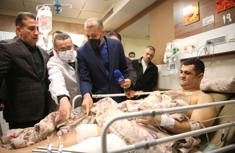  Iran's Foreign Minister Hossein Amir-Abdollahian visits one of the injured in the attack at the Embassy of the Republic of Azerbaijan, in Tajrish hospital in Tehran, Iran, January 27, 2023 (credit: HAMID FOROUTAN/POOL/WANA (WEST ASIA NEWS AGENCY) VIA REUTERS)